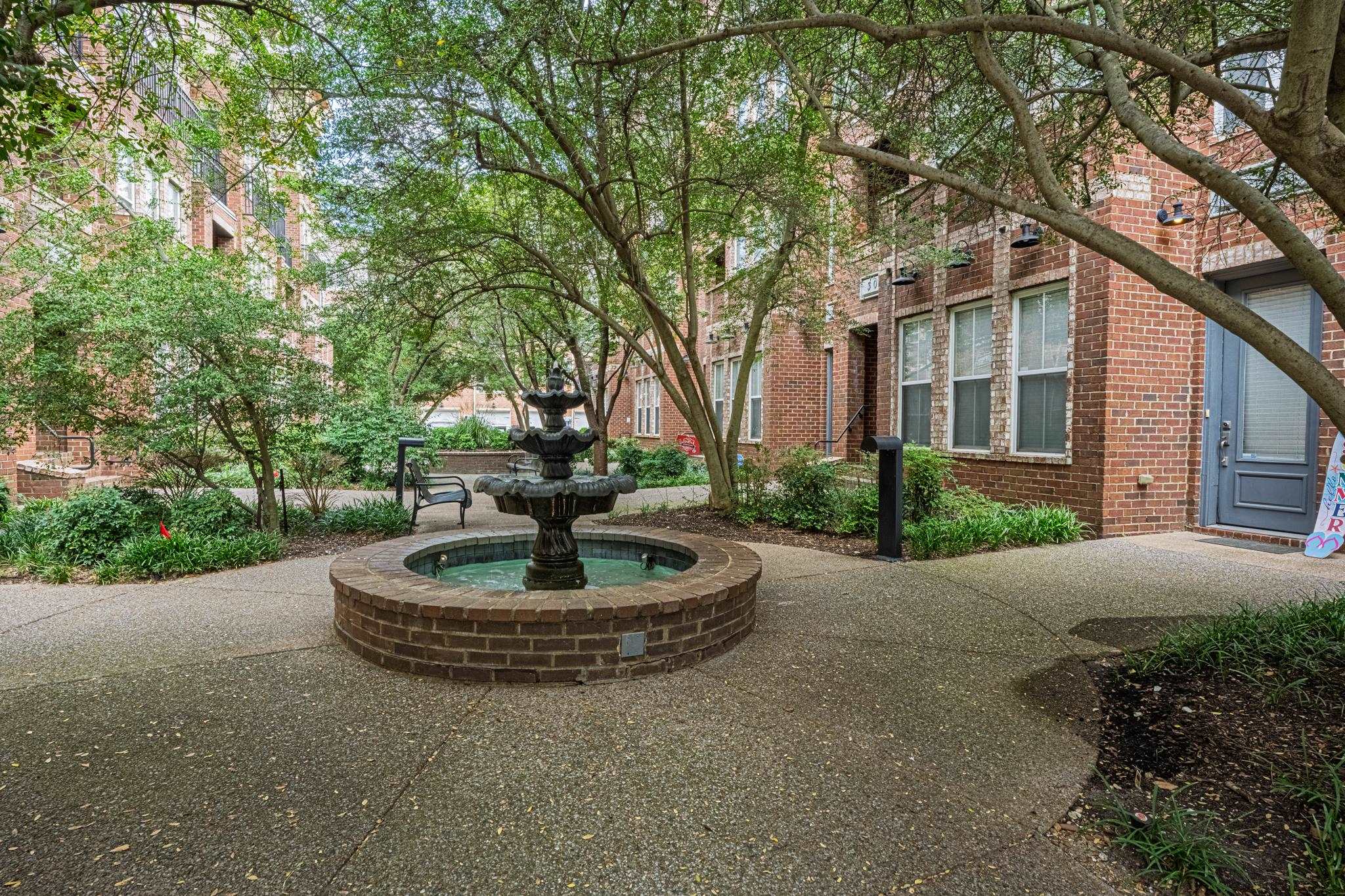 75 Shoemaker Court, Unit 105 Memphis, TN 38103 - Photo 22 of 25 a house with outdoor space and trees