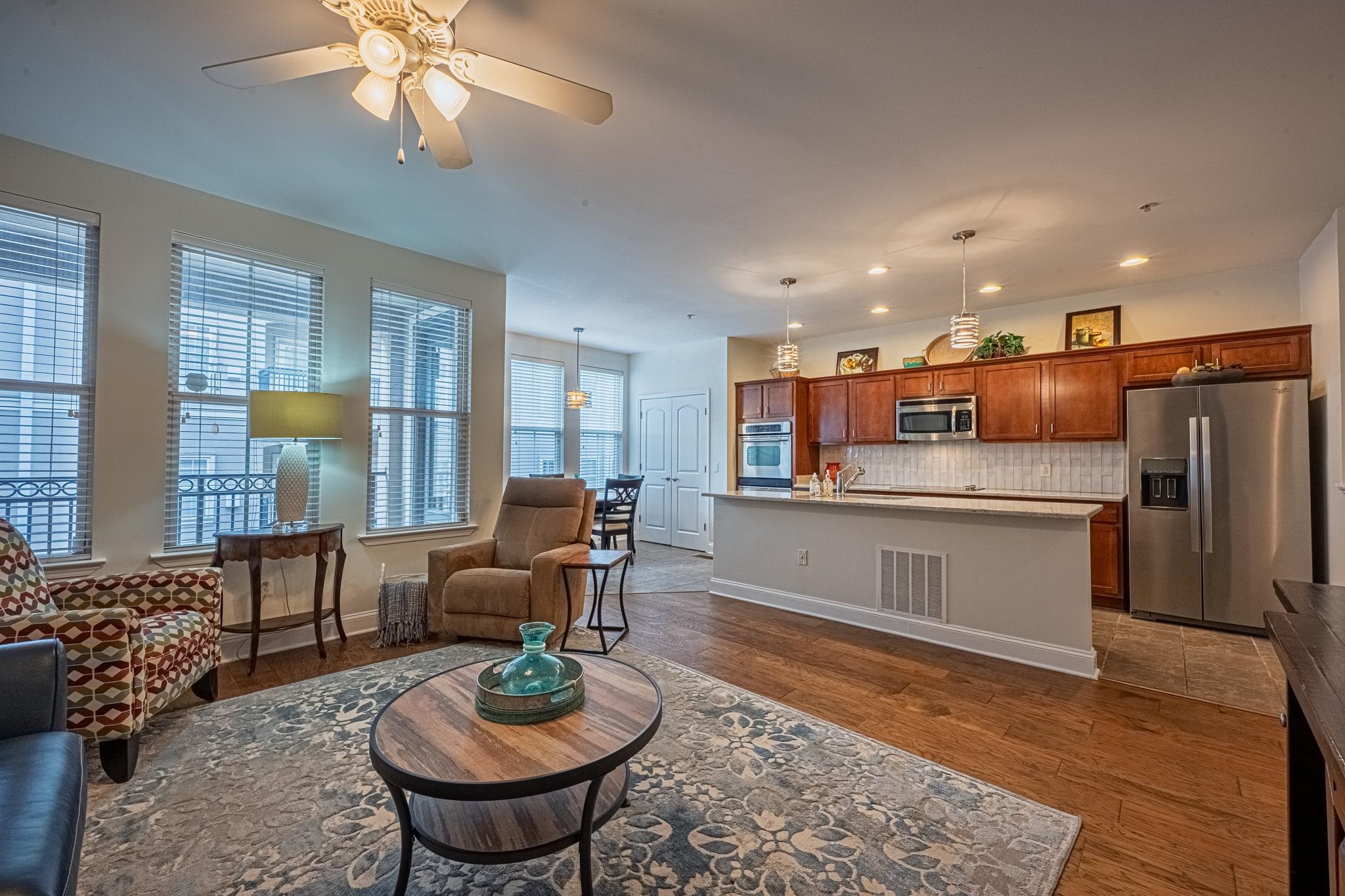 75 Shoemaker Court, Unit 105 Memphis, TN 38103 - Photo 6 of 25 a living room with stainless steel appliances furniture a rug and a window