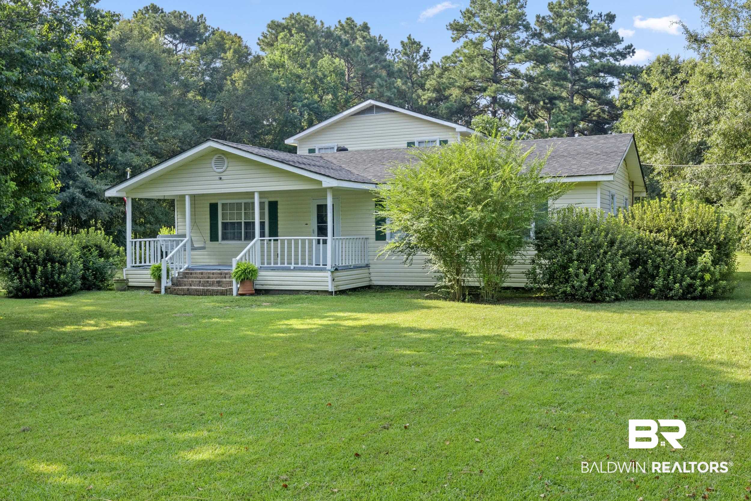 8701 A Rosemary Road Eight Mile, AL 36613 - Photo 3 of 27 View of front of home with a front lawn and a porch