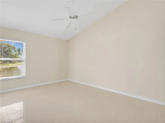 a spacious bathroom with a double vanity sink and a mirror