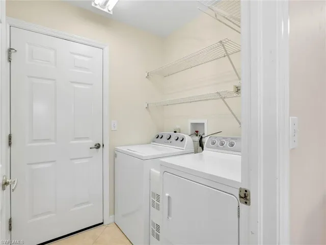 a view of a room with gym equipment and a window