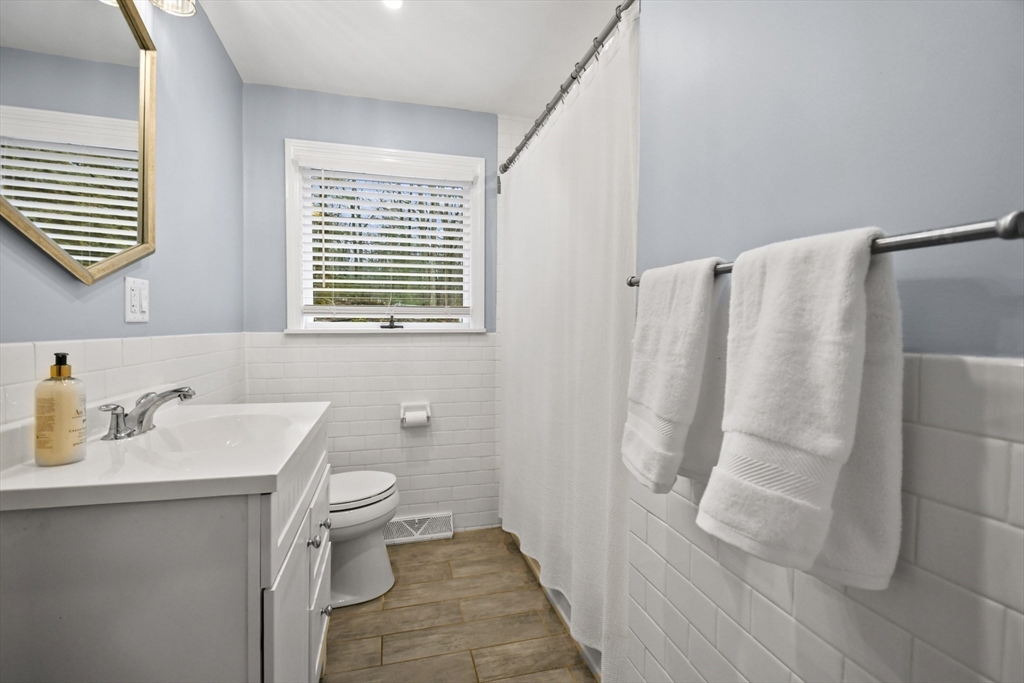 14 Town Line Road Burlington, MA 01803 - Photo 16 of 31 a bathroom with a sink toilet and shower