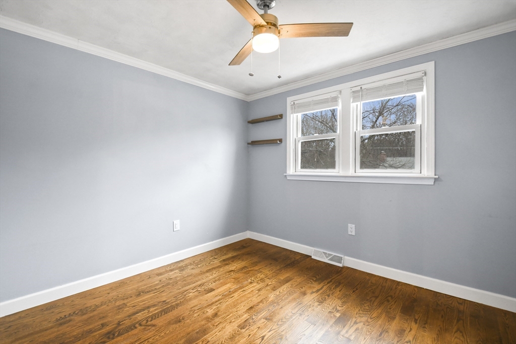 14 Town Line Road Burlington, MA 01803 - Photo 21 of 31 a view of empty room with wooden floor and fan