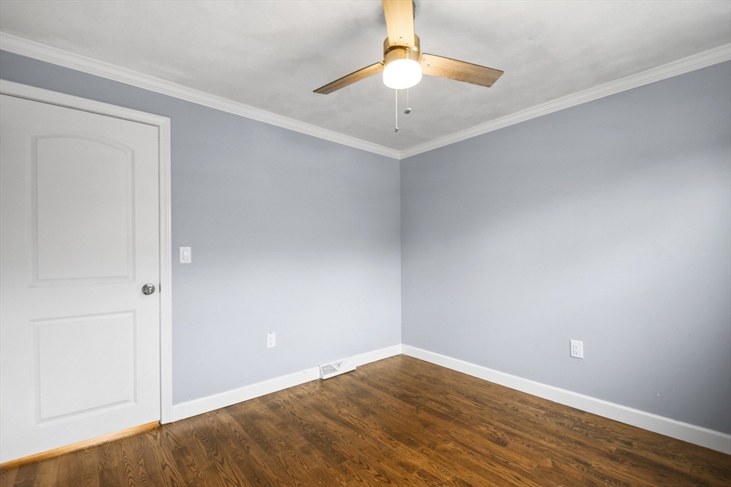 14 Town Line Road Burlington, MA 01803 - Photo 22 of 31 an empty room with wooden floor and fan