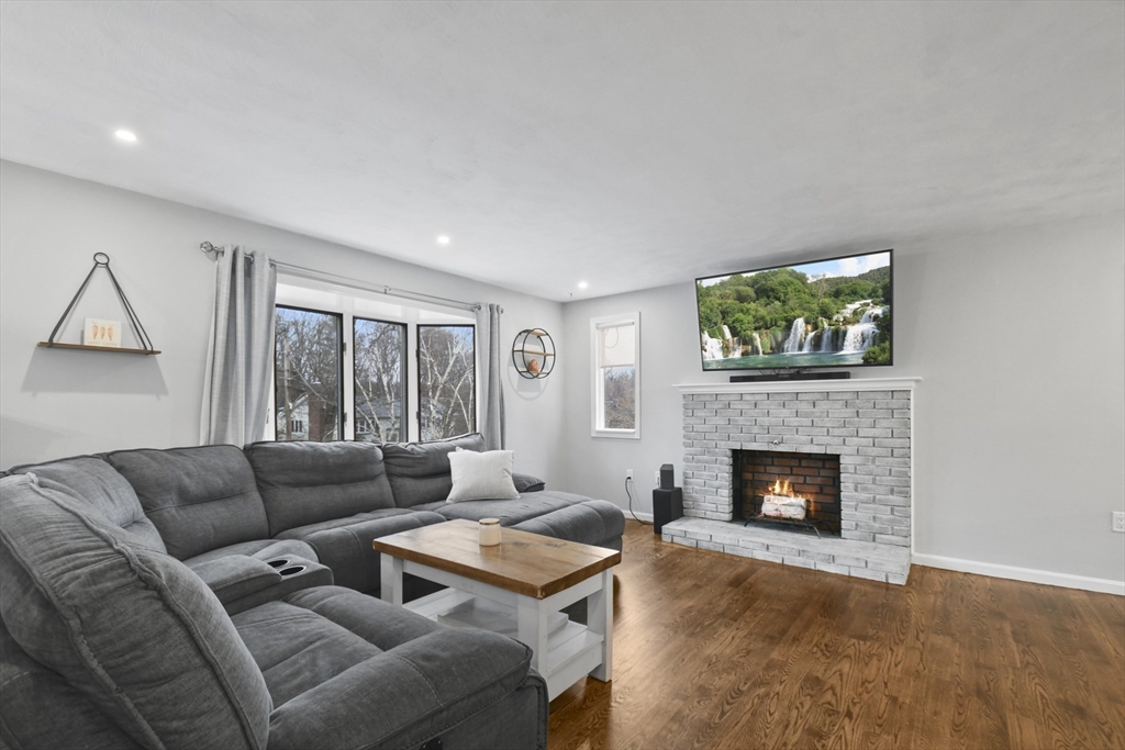14 Town Line Road Burlington, MA 01803 - Photo 6 of 31 a living room with furniture and a fireplace