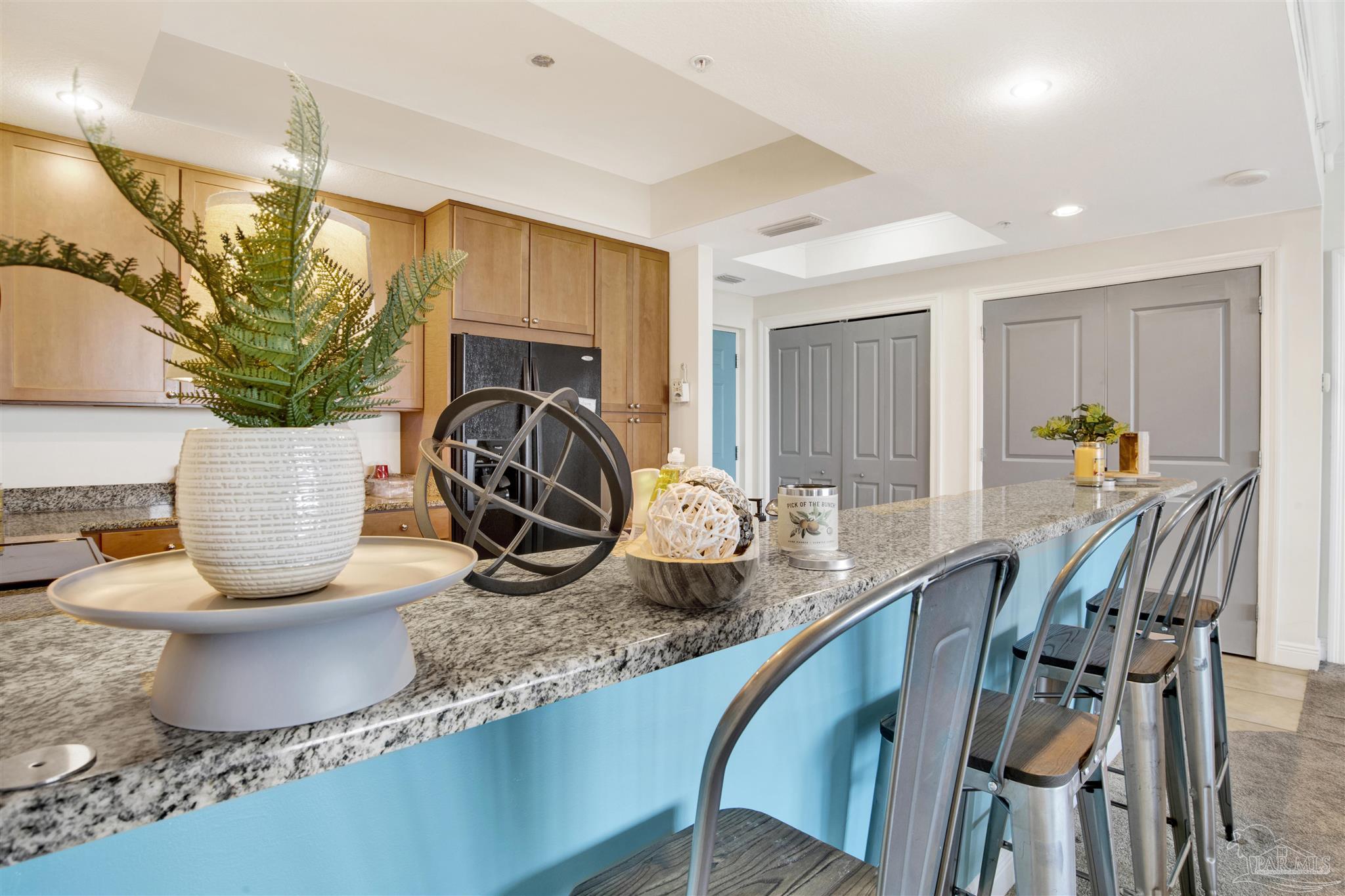 645 Lost Key Drive, Unit 704 Perdido Key, FL 32507 - Photo 12 of 31 a kitchen with a table and chairs