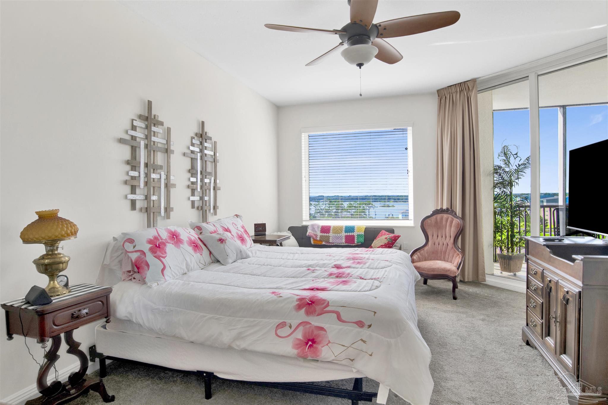 645 Lost Key Drive, Unit 704 Perdido Key, FL 32507 - Photo 15 of 31 a bedroom with a bed and a flat screen tv