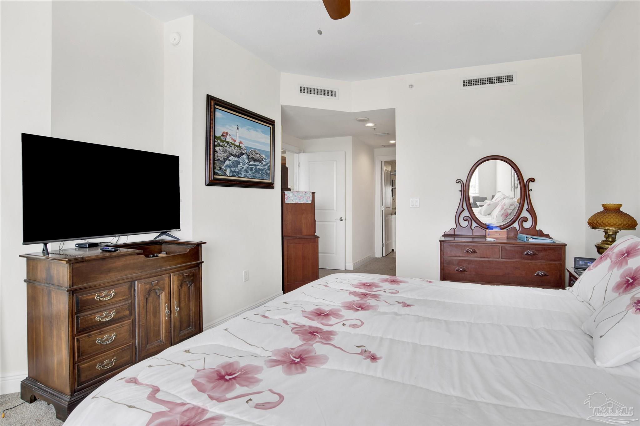 645 Lost Key Drive, Unit 704 Perdido Key, FL 32507 - Photo 16 of 31 a bedroom with a bed and a flat screen tv