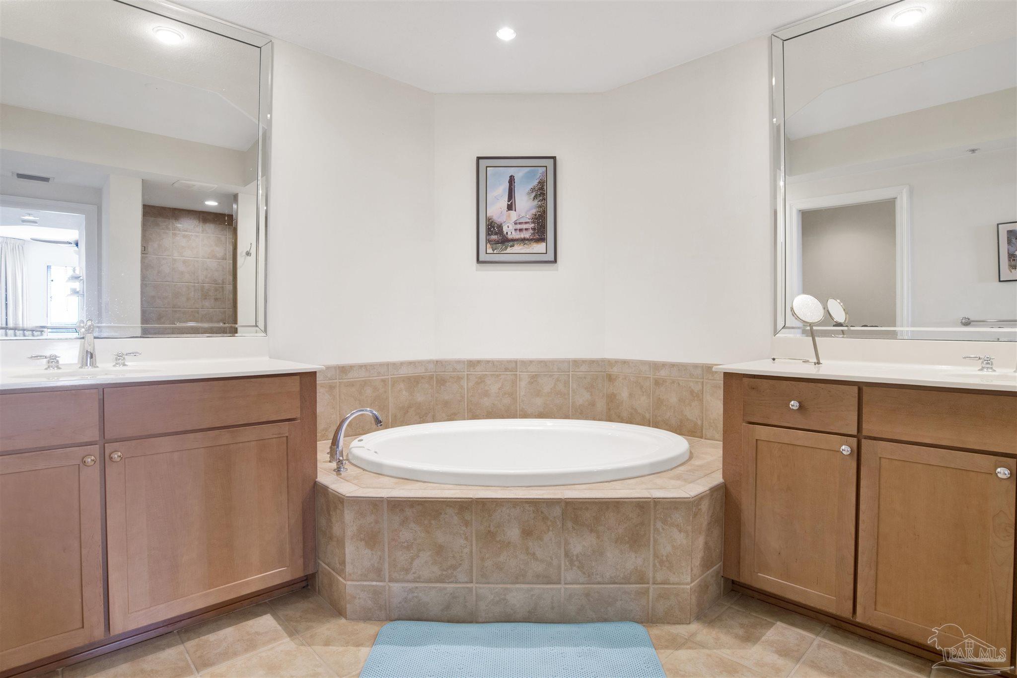 645 Lost Key Drive, Unit 704 Perdido Key, FL 32507 - Photo 18 of 31 a bathroom with a sink and a mirror