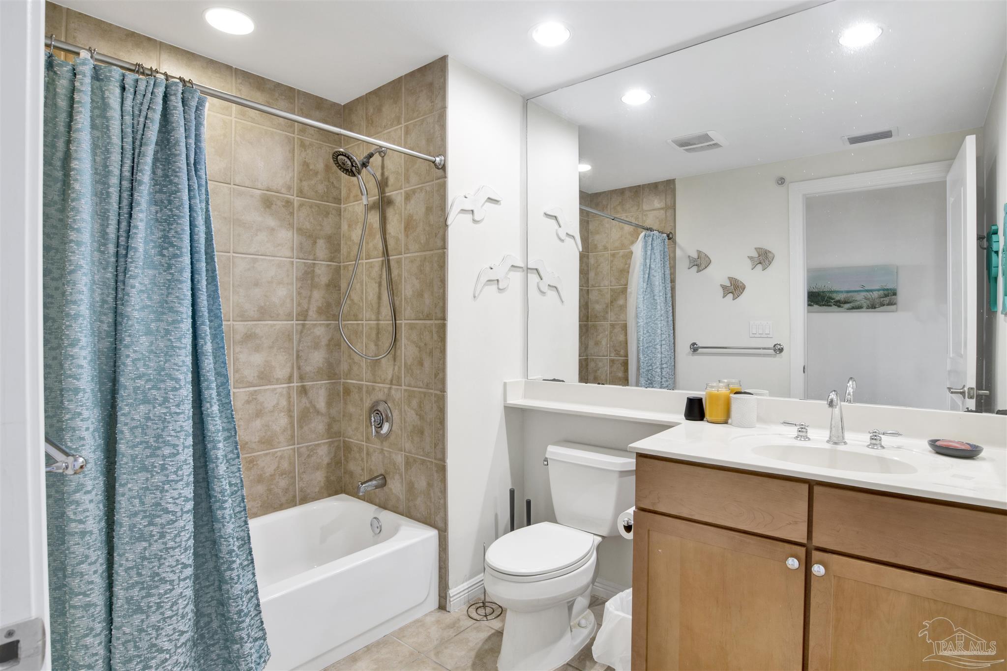 645 Lost Key Drive, Unit 704 Perdido Key, FL 32507 - Photo 22 of 31 a bathroom with a sink toilet and shower