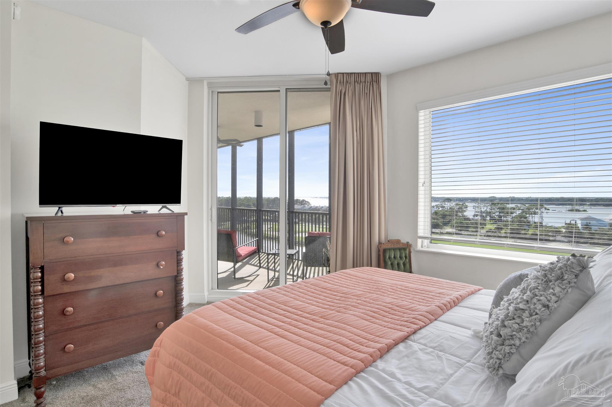 645 Lost Key Drive, Unit 704 Perdido Key, FL 32507 - Photo 23 of 31 a bedroom with a bed and a flat screen tv