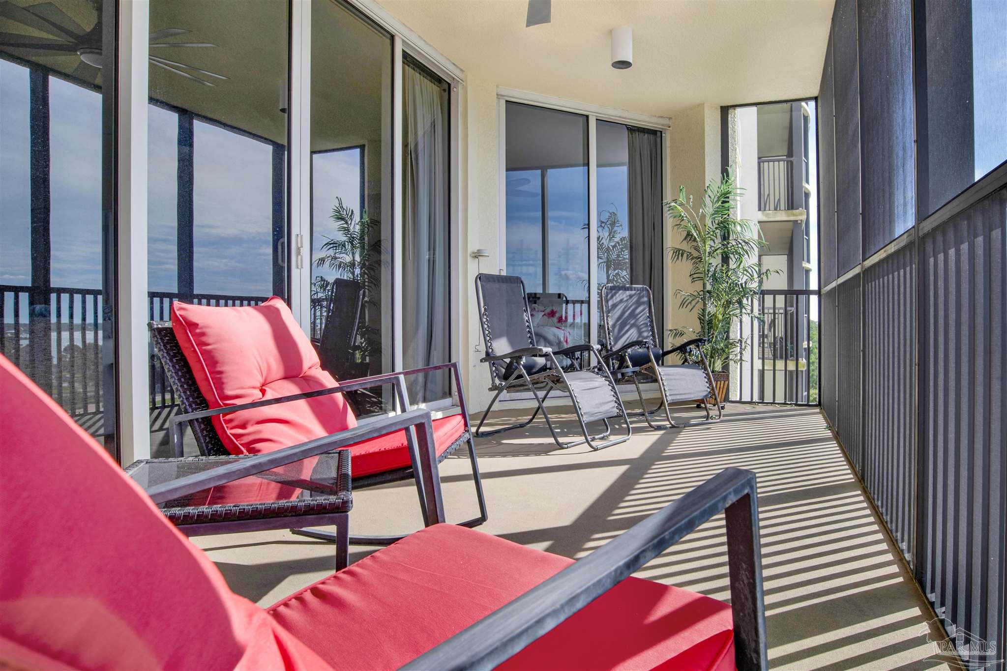 645 Lost Key Drive, Unit 704 Perdido Key, FL 32507 - Photo 27 of 31 a building outdoor space with patio furniture and wooden floor