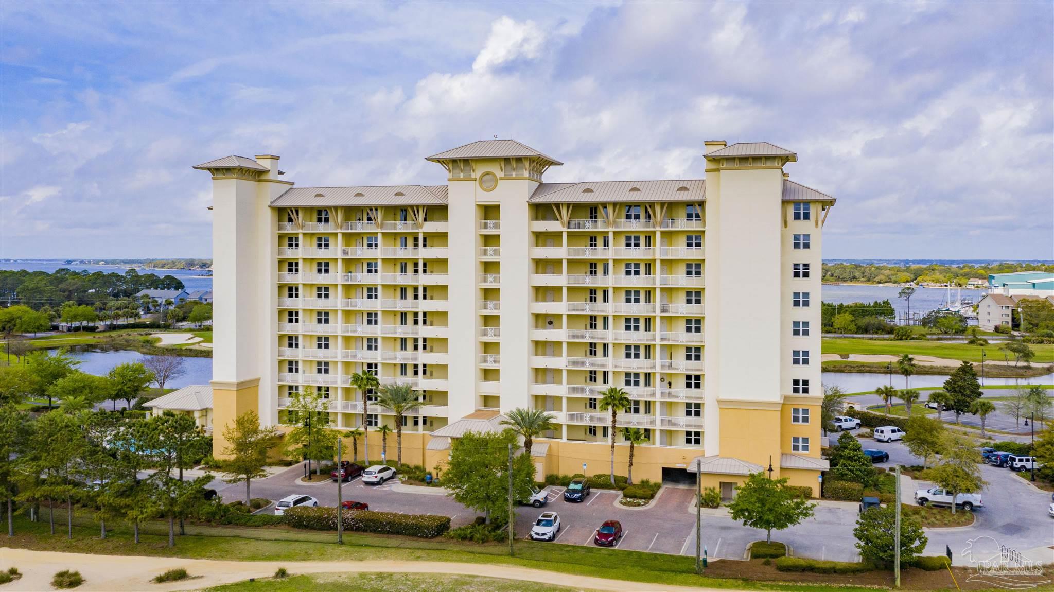 645 Lost Key Drive, Unit 704 Perdido Key, FL 32507 - Photo 4 of 31 front view of a building with a garden
