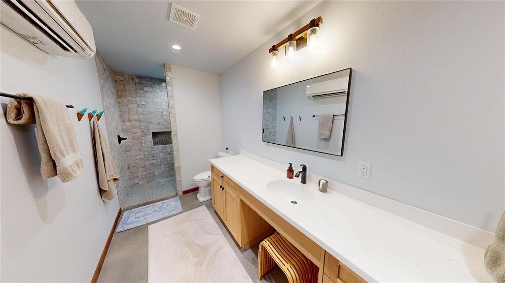 419 Rochelle Tx 76872 Brady, TX 76825 - Photo 14 of 34 a bathroom with a double vanity sink and mirror