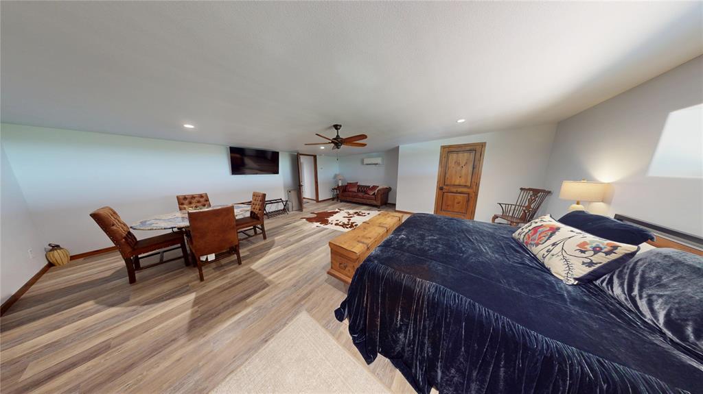 419 Rochelle Tx 76872 Brady, TX 76825 - Photo 19 of 34 a bedroom with furniture and a wooden floor