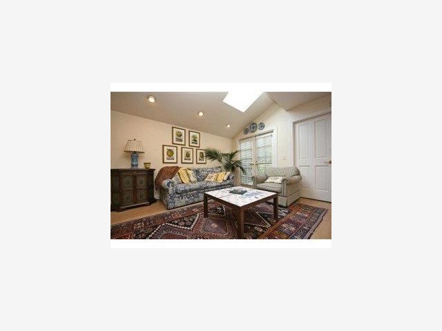 2-nw San Antonio/8th Carmel, CA 93921 - Photo 6 of 9 a living room with furniture and a table