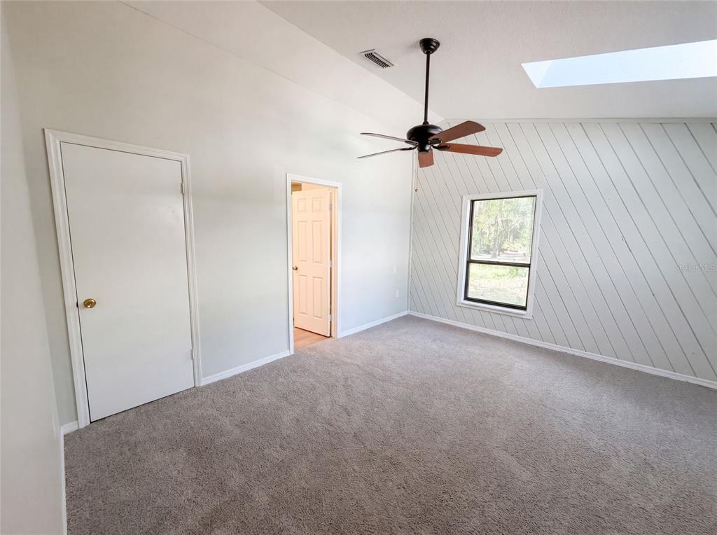 3739 Lake Griffin Road Lady Lake, FL 32159 - Photo 4 of 21 an empty room with windows and fan