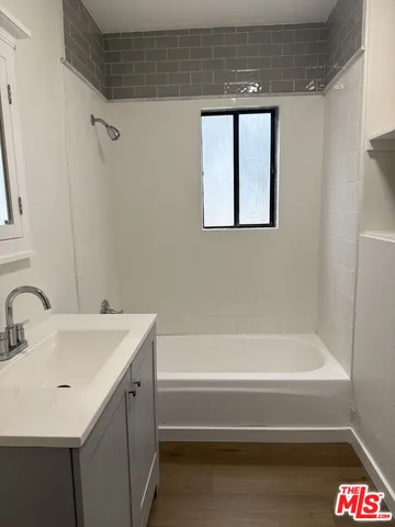 a bathroom with a sink and a bathtub