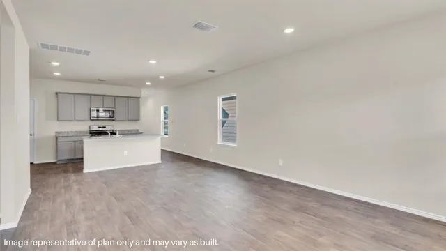 a view of kitchen with wooden floor