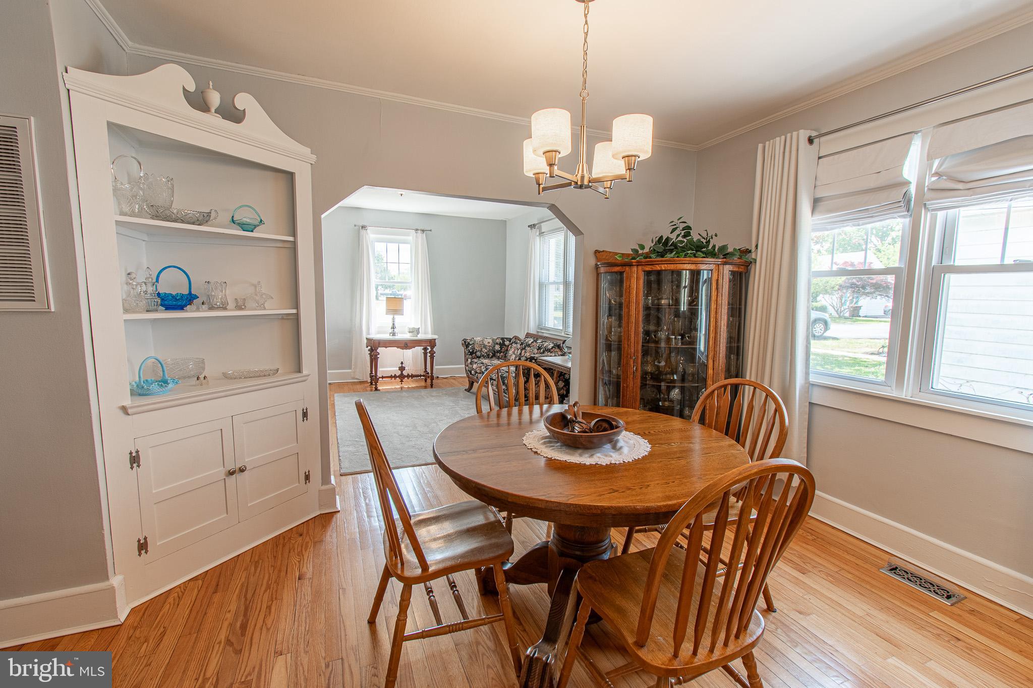 207 Crusader Road Cambridge, MD 21613 - Photo 23 of 76 a view of a dining room with furniture window and wooden floor