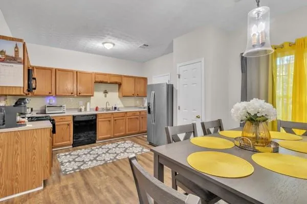 a kitchen with a sink appliances and cabinets