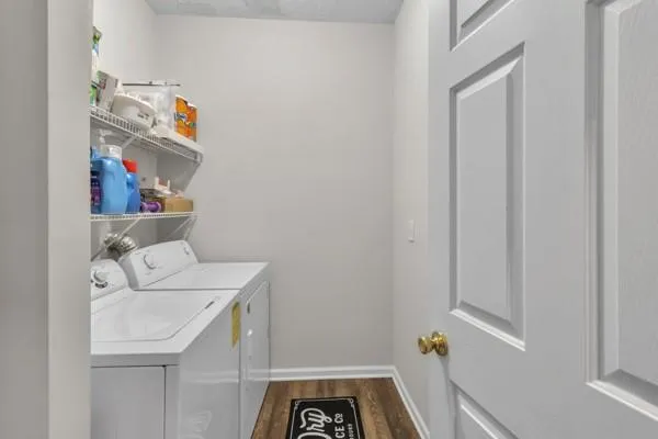 a utility room with a sink dryer and washer