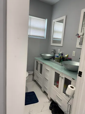 a kitchen with a sink and a stove