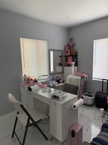 a view of a workspace with furniture