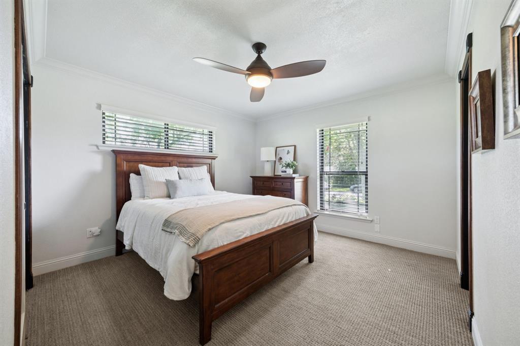14380 Olympic Drive Farmers Branch, TX 75234 - Photo 19 of 33 a spacious bedroom with a bed and a window