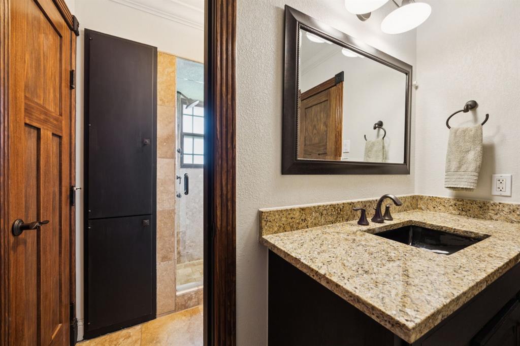 14380 Olympic Drive Farmers Branch, TX 75234 - Photo 20 of 33 a bathroom with a granite countertop sink and a mirror