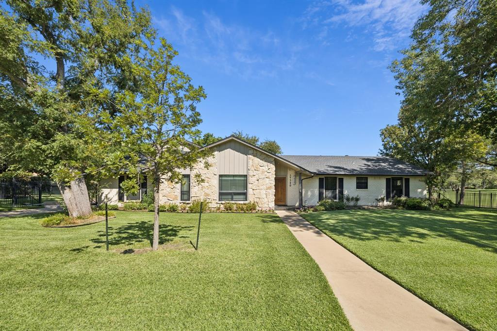 14380 Olympic Drive Farmers Branch, TX 75234 - Photo 2 of 33 a front view of a house with a yard