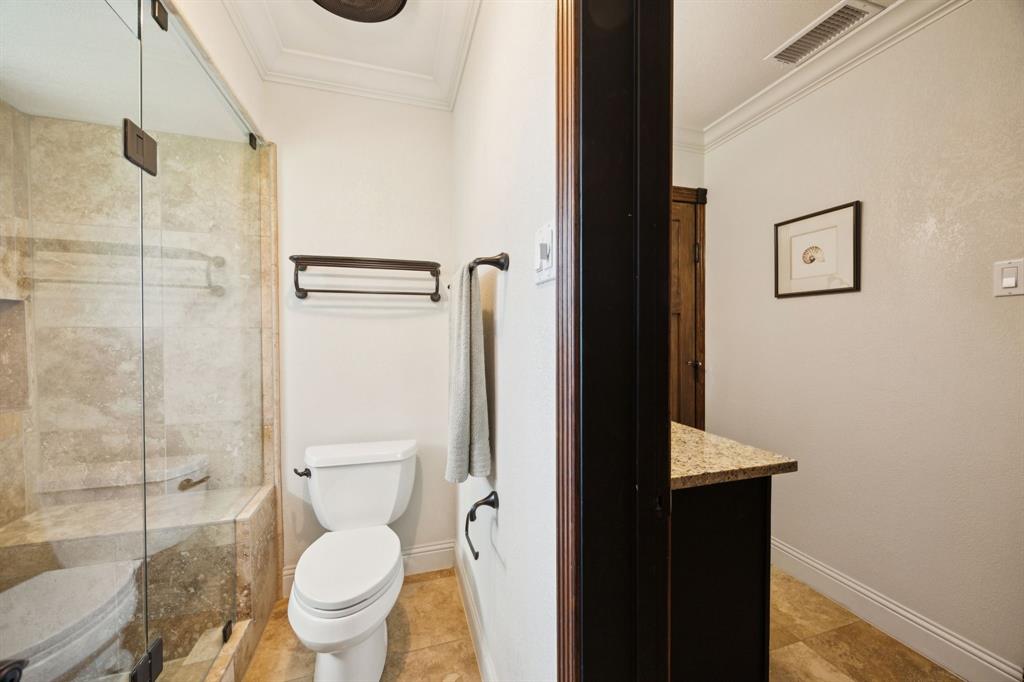 14380 Olympic Drive Farmers Branch, TX 75234 - Photo 21 of 33 a bathroom with a toilet and a shower