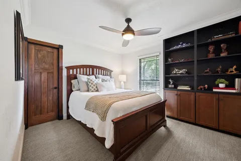 a kitchen with stainless steel appliances granite countertop a sink refrigerator and cabinets