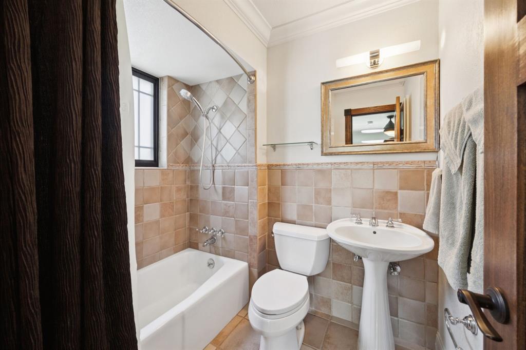 14380 Olympic Drive Farmers Branch, TX 75234 - Photo 25 of 33 a bathroom with a toilet sink and mirror