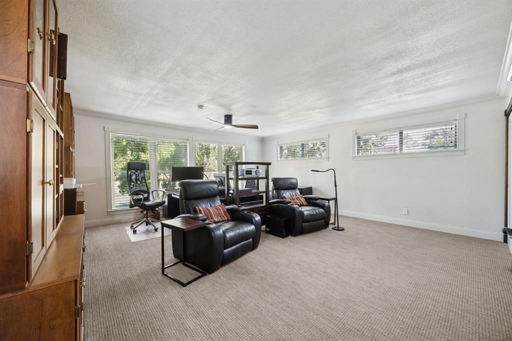14380 Olympic Drive Farmers Branch, TX 75234 - Photo 26 of 33 a living room with furniture and a flat screen tv