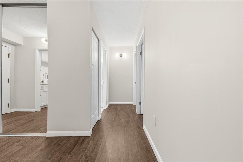 5600 Munhall Road, Unit 309 Pittsburgh, PA 15217 - Photo 15 of 40 a view of a hallway with wooden floor