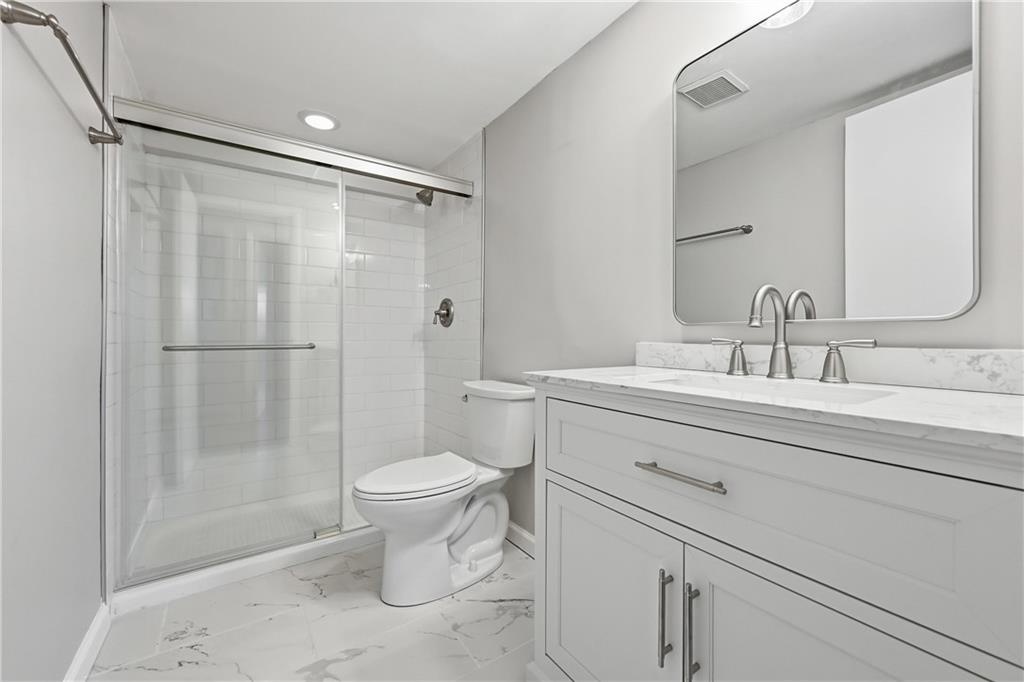 5600 Munhall Road, Unit 309 Pittsburgh, PA 15217 - Photo 16 of 40 a bathroom with a sink toilet and shower