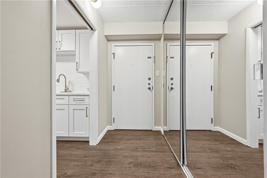 5600 Munhall Road, Unit 309 Pittsburgh, PA 15217 - Photo 24 of 40 a view of a hallway with wooden floor and closet area