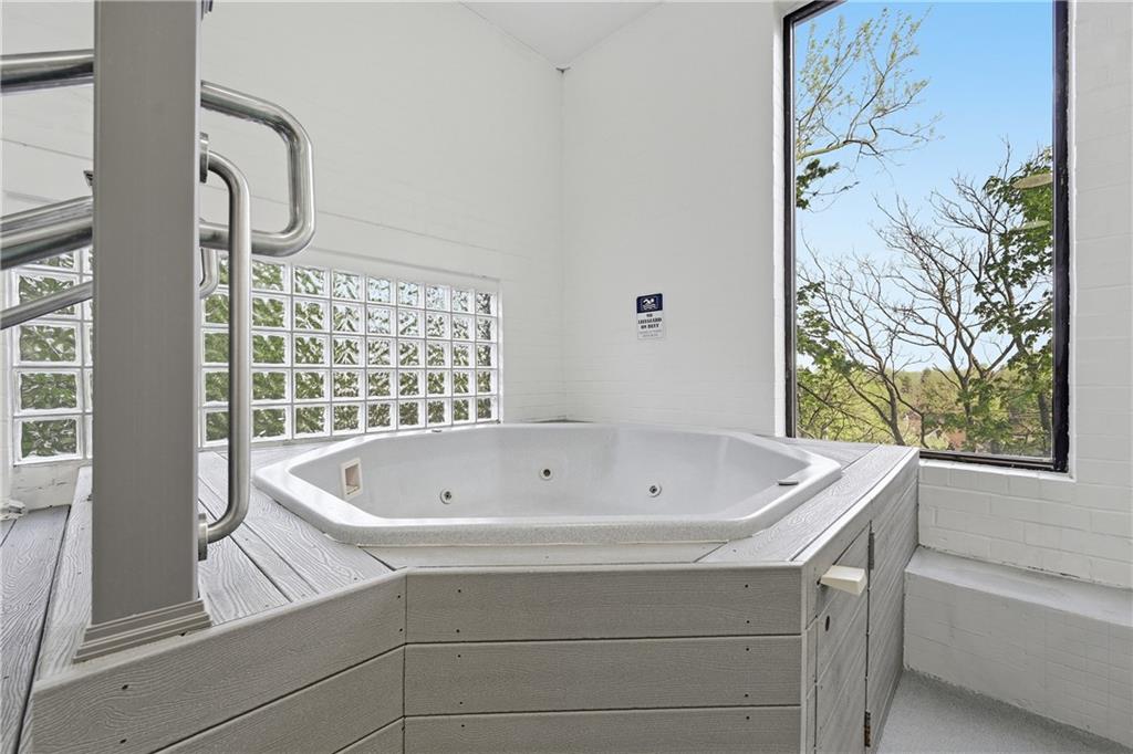 5600 Munhall Road, Unit 309 Pittsburgh, PA 15217 - Photo 30 of 40 a bathroom with a bathtub and shower