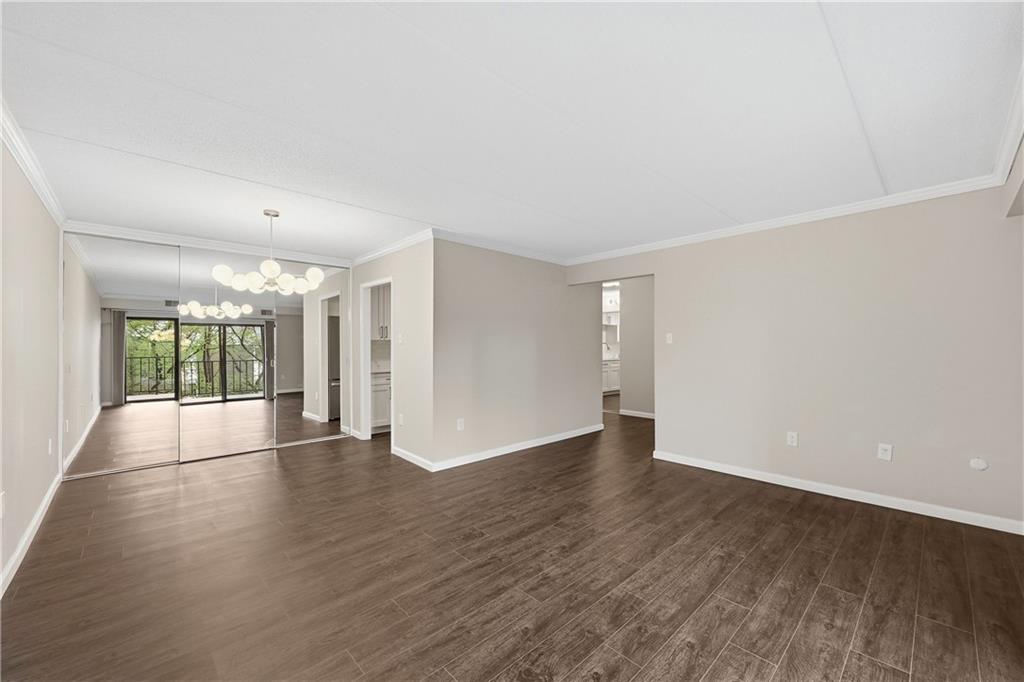 5600 Munhall Road, Unit 309 Pittsburgh, PA 15217 - Photo 4 of 40 an empty room with wooden floor and windows