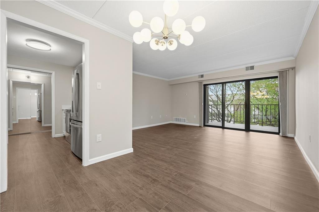 5600 Munhall Road, Unit 309 Pittsburgh, PA 15217 - Photo 5 of 40 a view of a livingroom with wooden floor