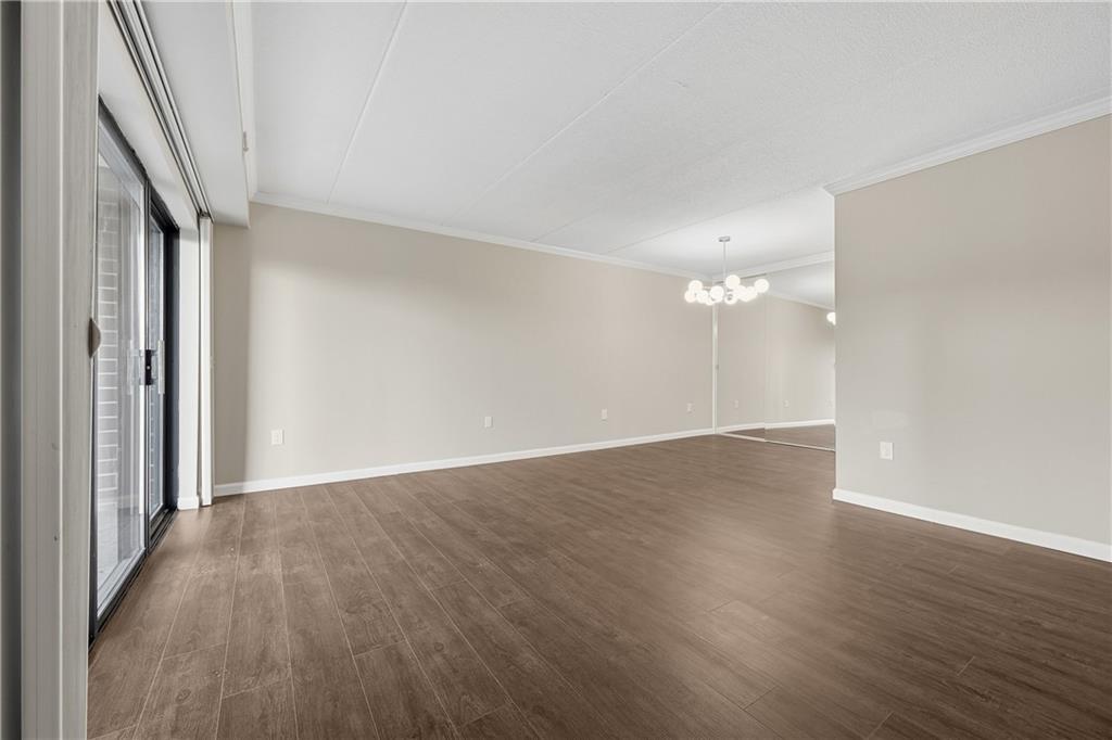 5600 Munhall Road, Unit 309 Pittsburgh, PA 15217 - Photo 6 of 40 wooden floor in an empty room with a window