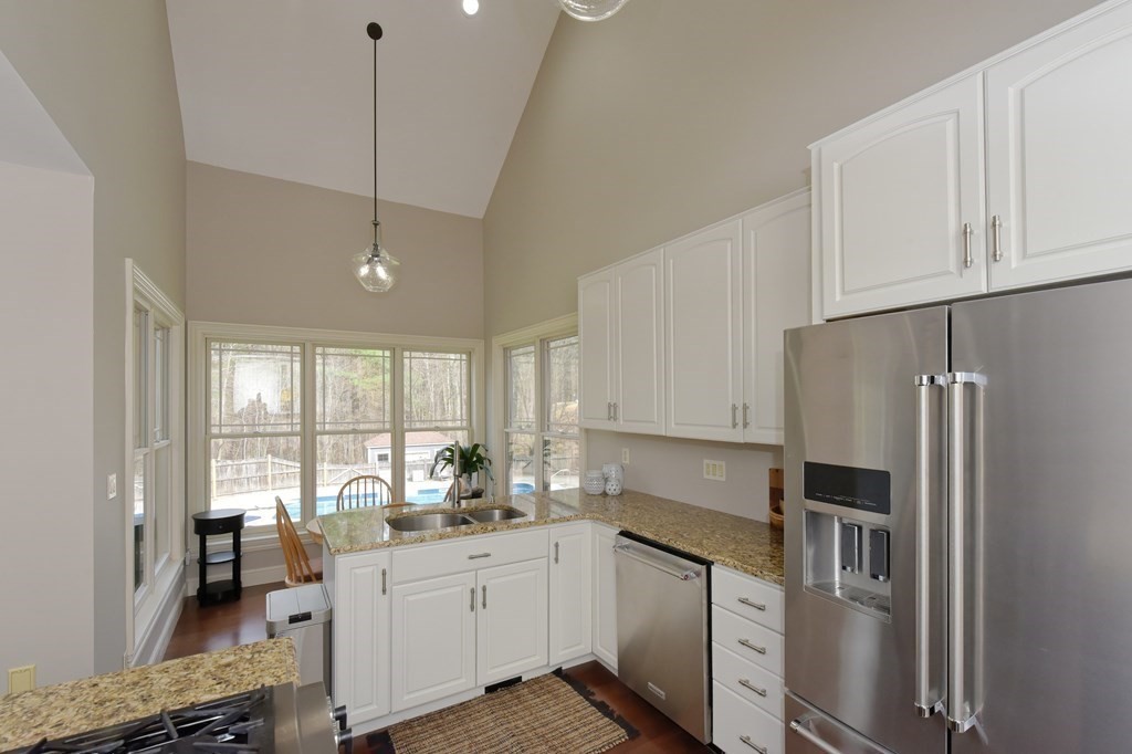 125 Brookside Drive Uxbridge, MA 01569 - Photo 13 of 40 a kitchen with granite countertop a refrigerator stove top oven and sink