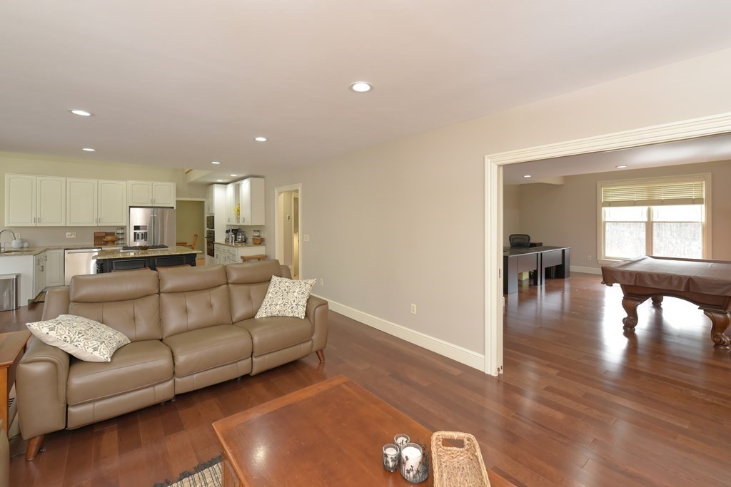 125 Brookside Drive Uxbridge, MA 01569 - Photo 15 of 40 a living room with furniture and a view of kitchen