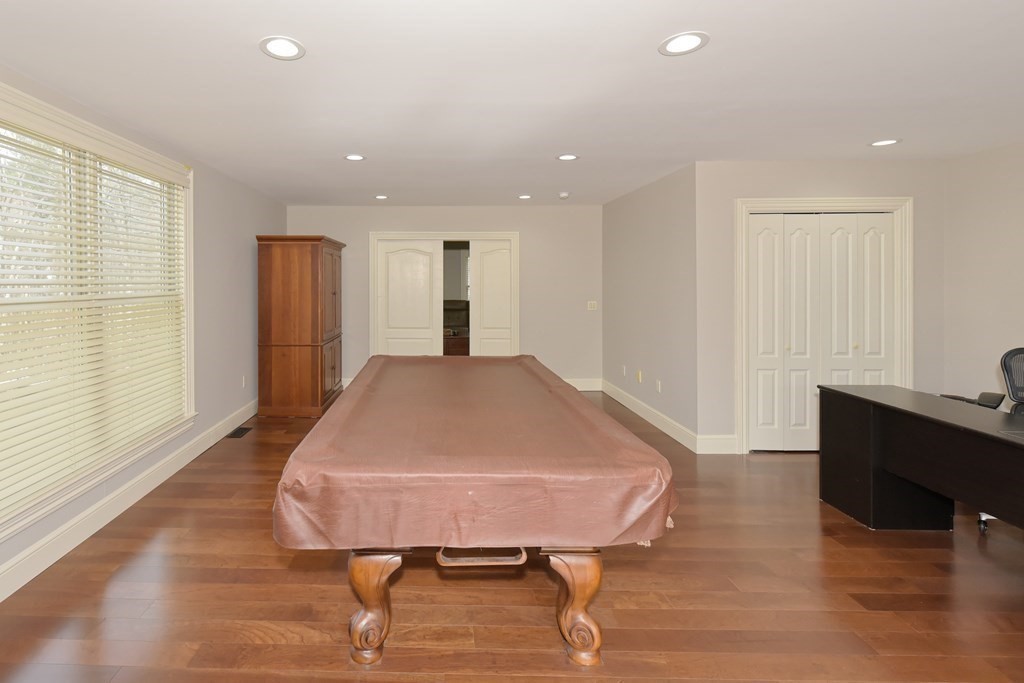 125 Brookside Drive Uxbridge, MA 01569 - Photo 17 of 40 a living room with furniture and a wooden floor