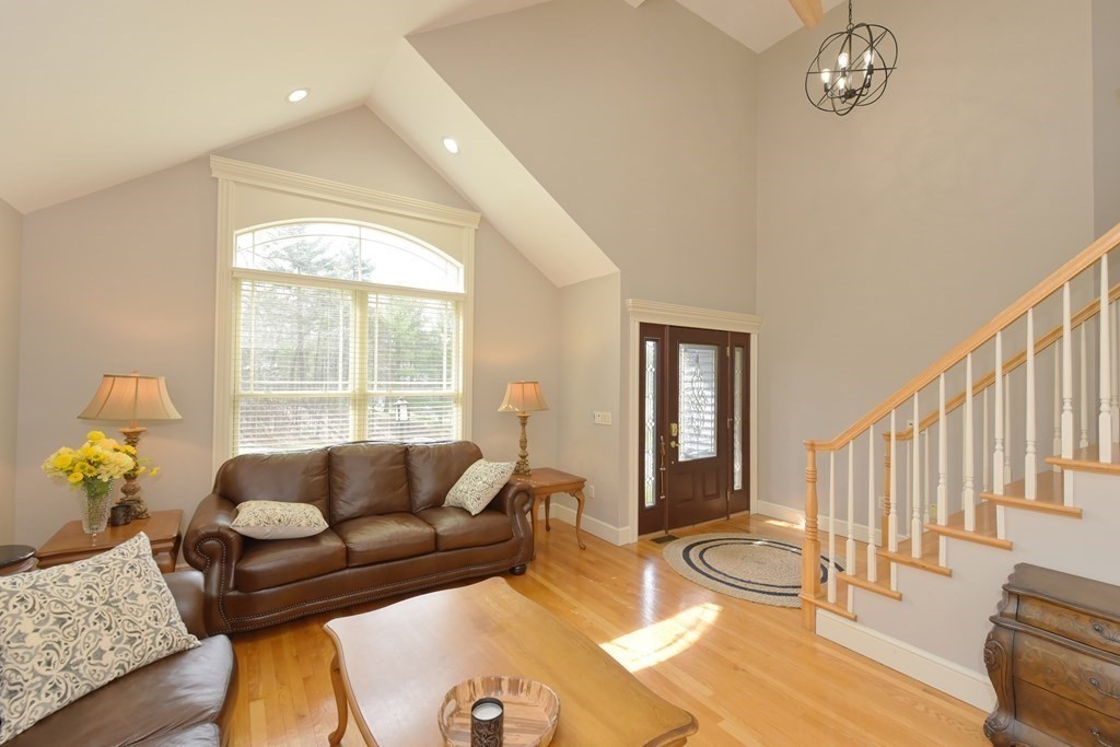 125 Brookside Drive Uxbridge, MA 01569 - Photo 19 of 40 a living room with furniture and a window