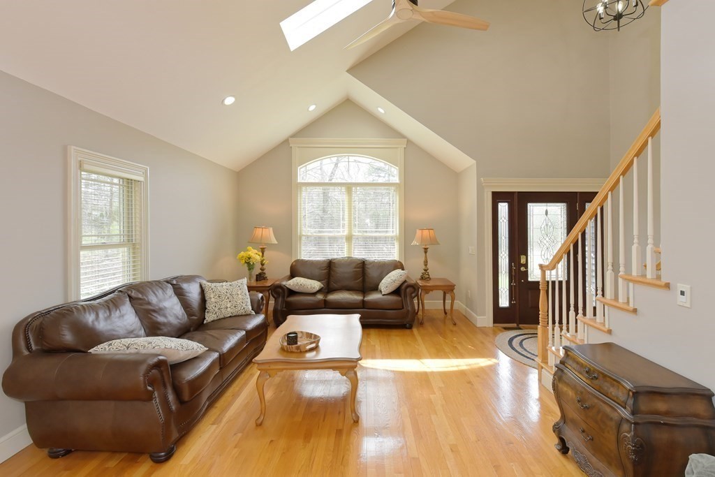 125 Brookside Drive Uxbridge, MA 01569 - Photo 20 of 40 a living room with furniture and a large window