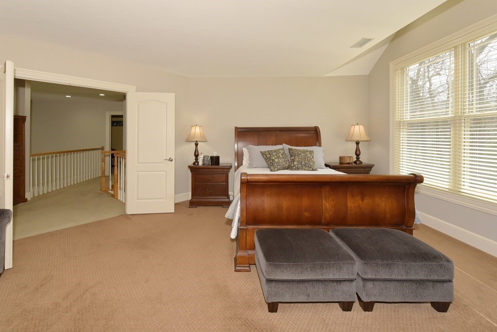 125 Brookside Drive Uxbridge, MA 01569 - Photo 24 of 40 a bedroom with a bed and window