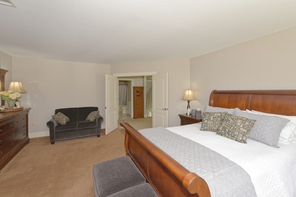 125 Brookside Drive Uxbridge, MA 01569 - Photo 25 of 40 a bedroom with a bed and a couch