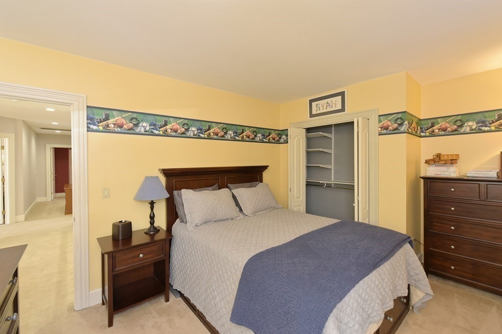 125 Brookside Drive Uxbridge, MA 01569 - Photo 28 of 40 a bedroom with a bed and a night stand